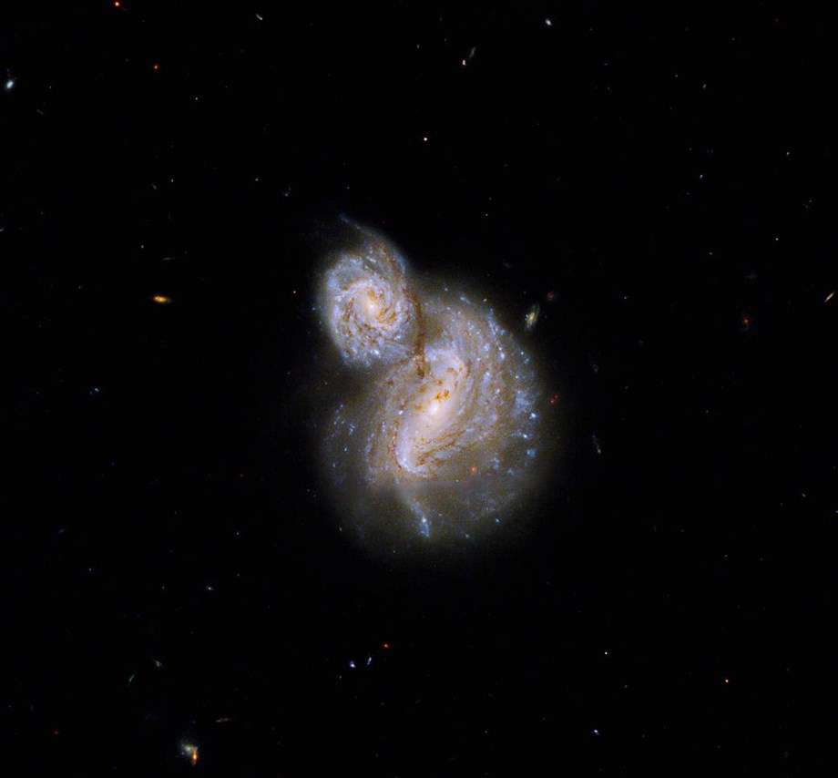 Hubble snaps curious pair of spiral galaxies 800 million light-years away from Earth - Devdiscourse